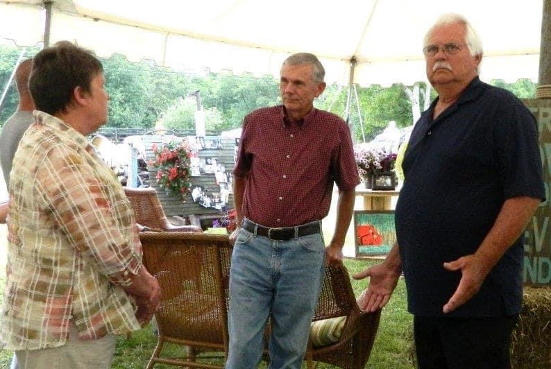 Photo of Ben Cates (center) having one of the thousands of conversations with friends. Photo from Jan Stewart.